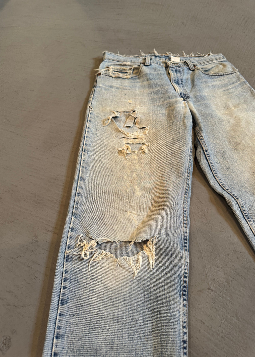 1990s Levi's 550 Repaired Light Wash Jeans